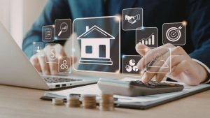 image of someone working on a computer with real estate